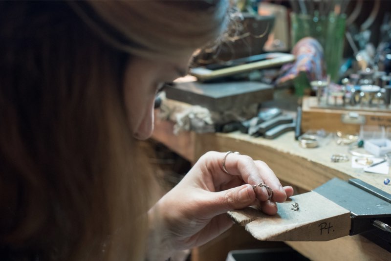 Emily at work at her bench