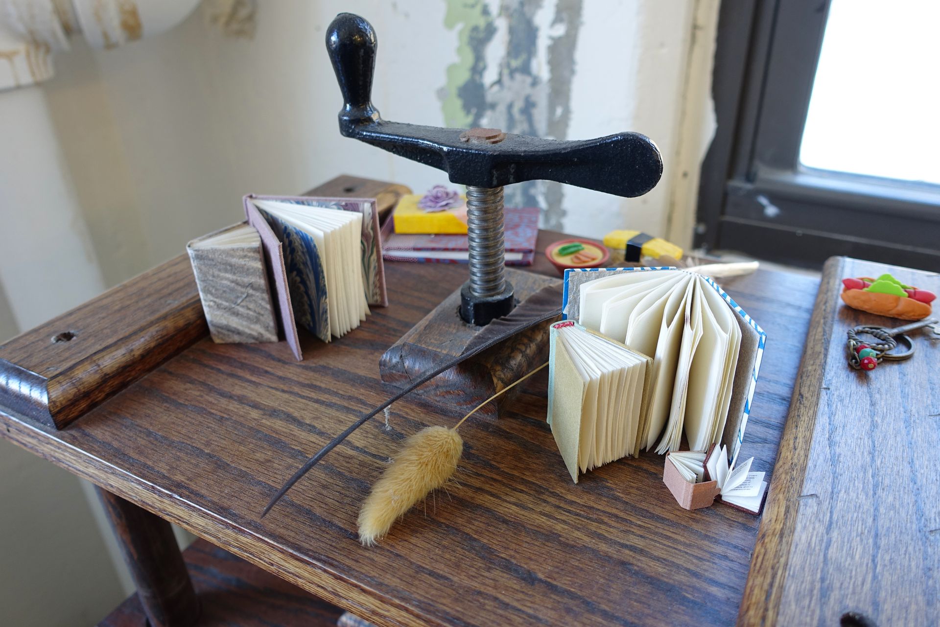 Miniature bound books on display