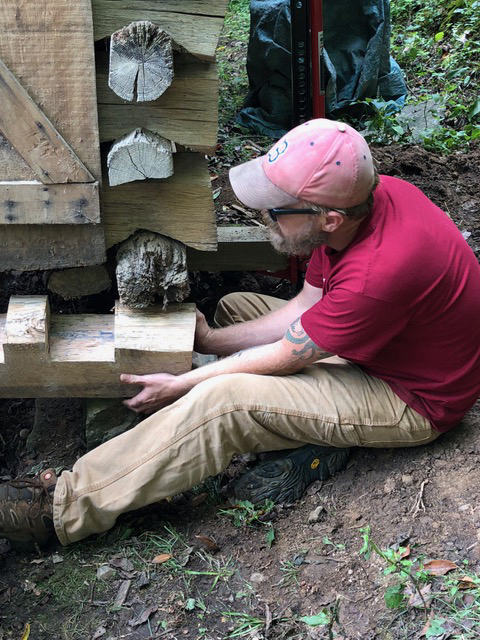 Kyle working on a timber frame