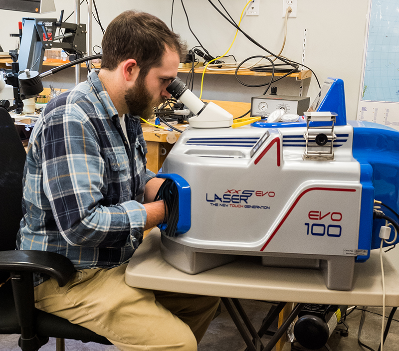 Student using laser welder