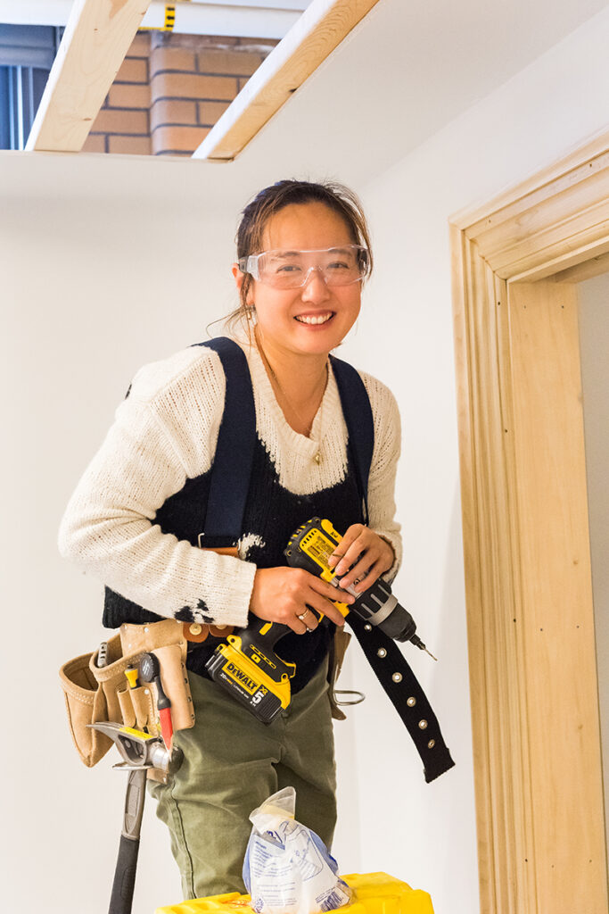 Student working on door trim