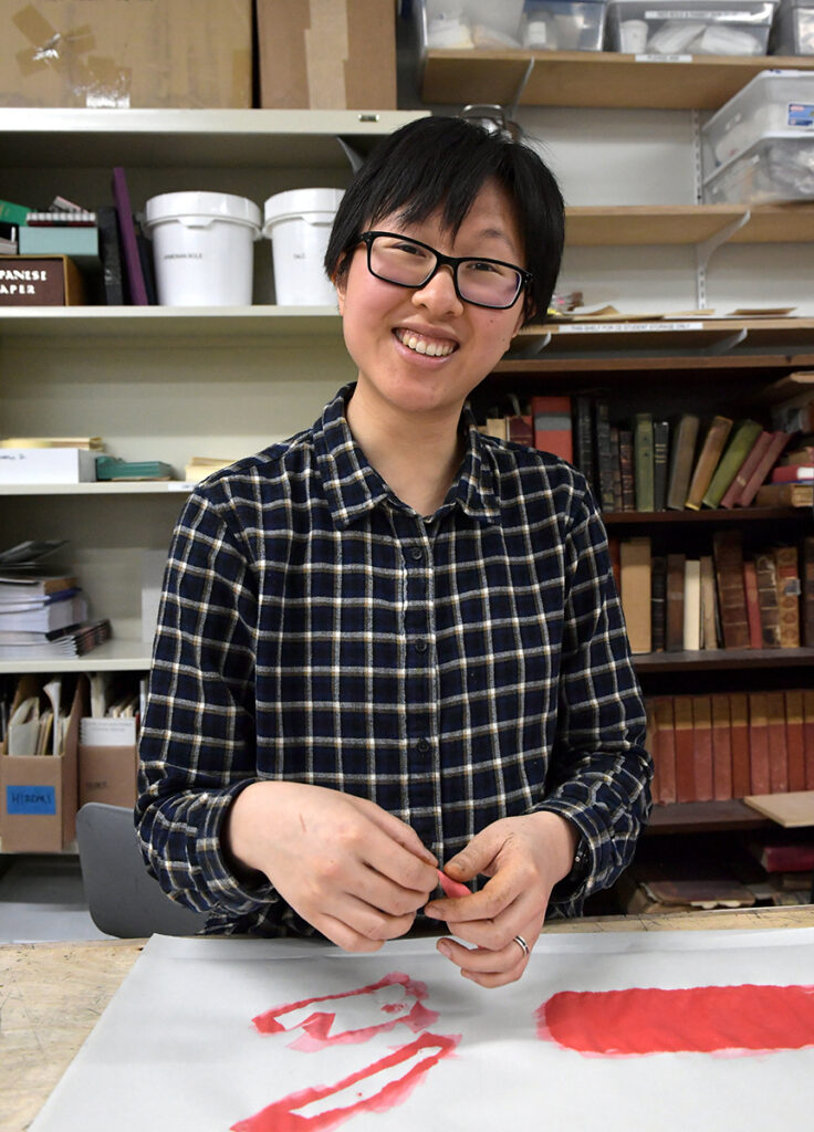 Yi Bin dyeing leather at NBSS