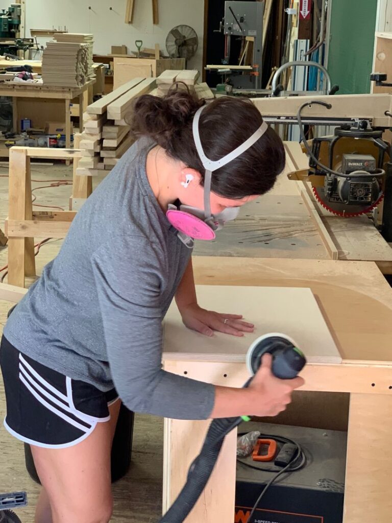 Emily working on a table top