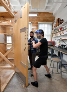 Locksmithing class at work on a door blank