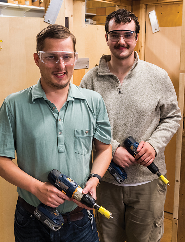 Two Locksmithing students at work