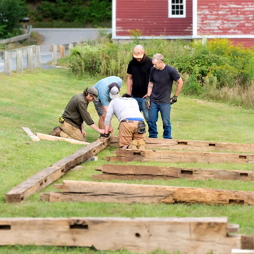 Students working on a timber frame