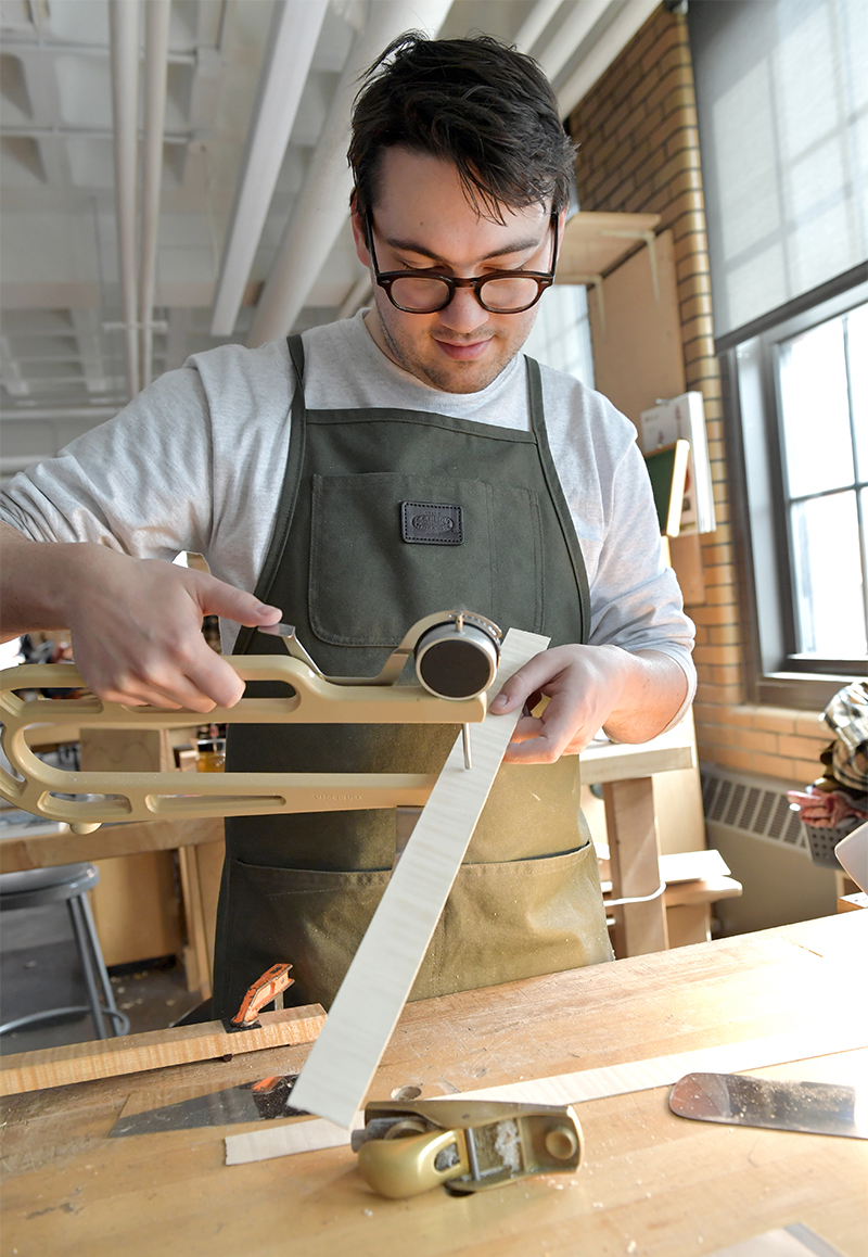 Student Nathan measuring ribs with a caliper