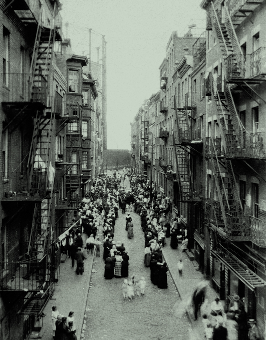 Historic photo: view of a crowded North End street