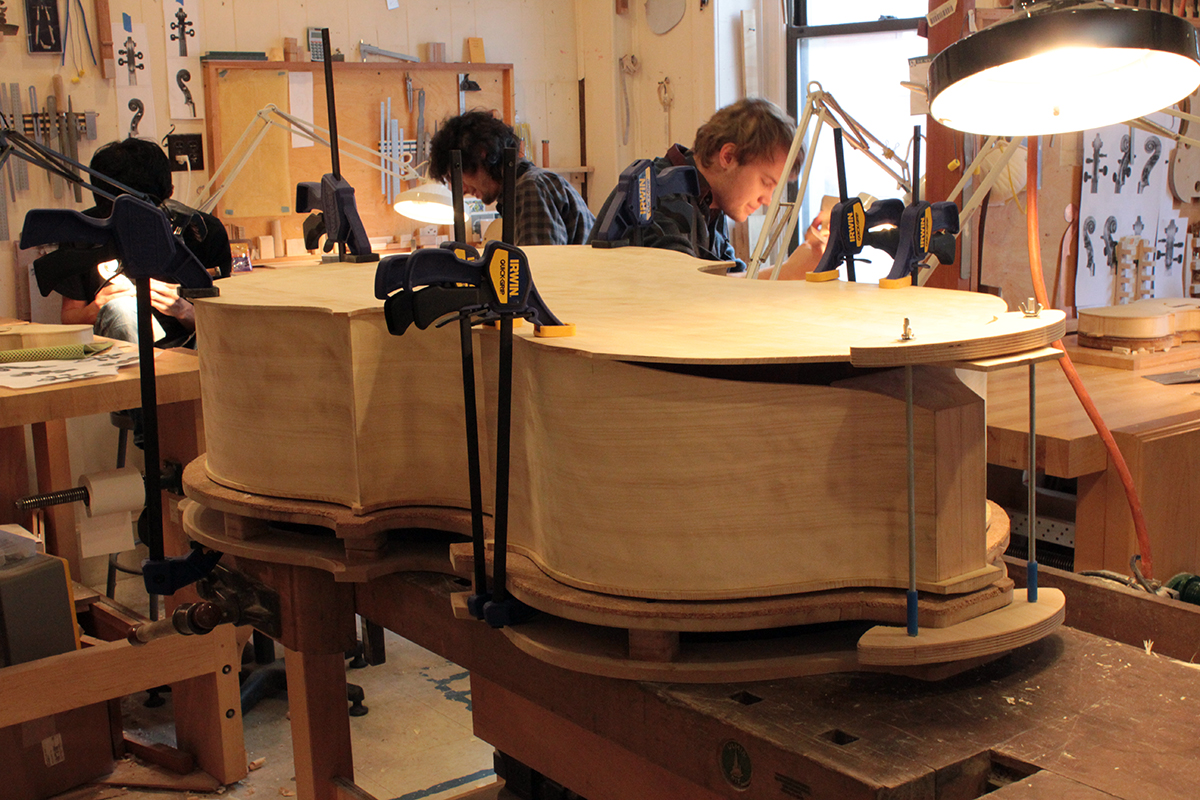 Preparing for the delicate process of heating and bending the back of the instrument.
