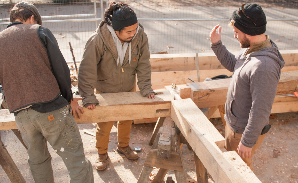 Hollis working with his Preservation Carpentry classmates on a timber frame structure.