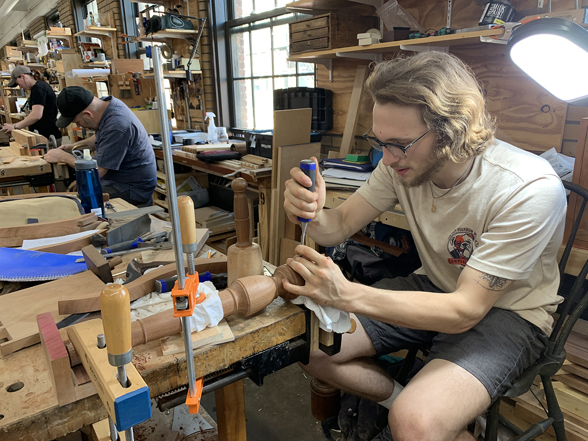 Matt working on a table pedestal