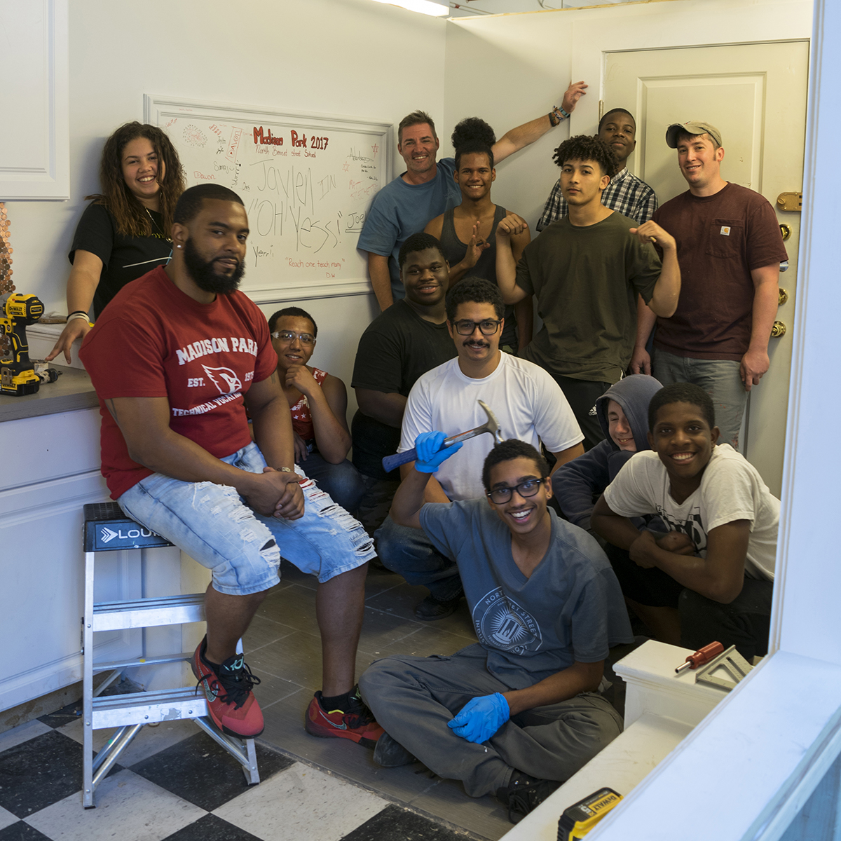 Jonathan (center) taught a locksmithing session to our Madison Park summer students in 2017.