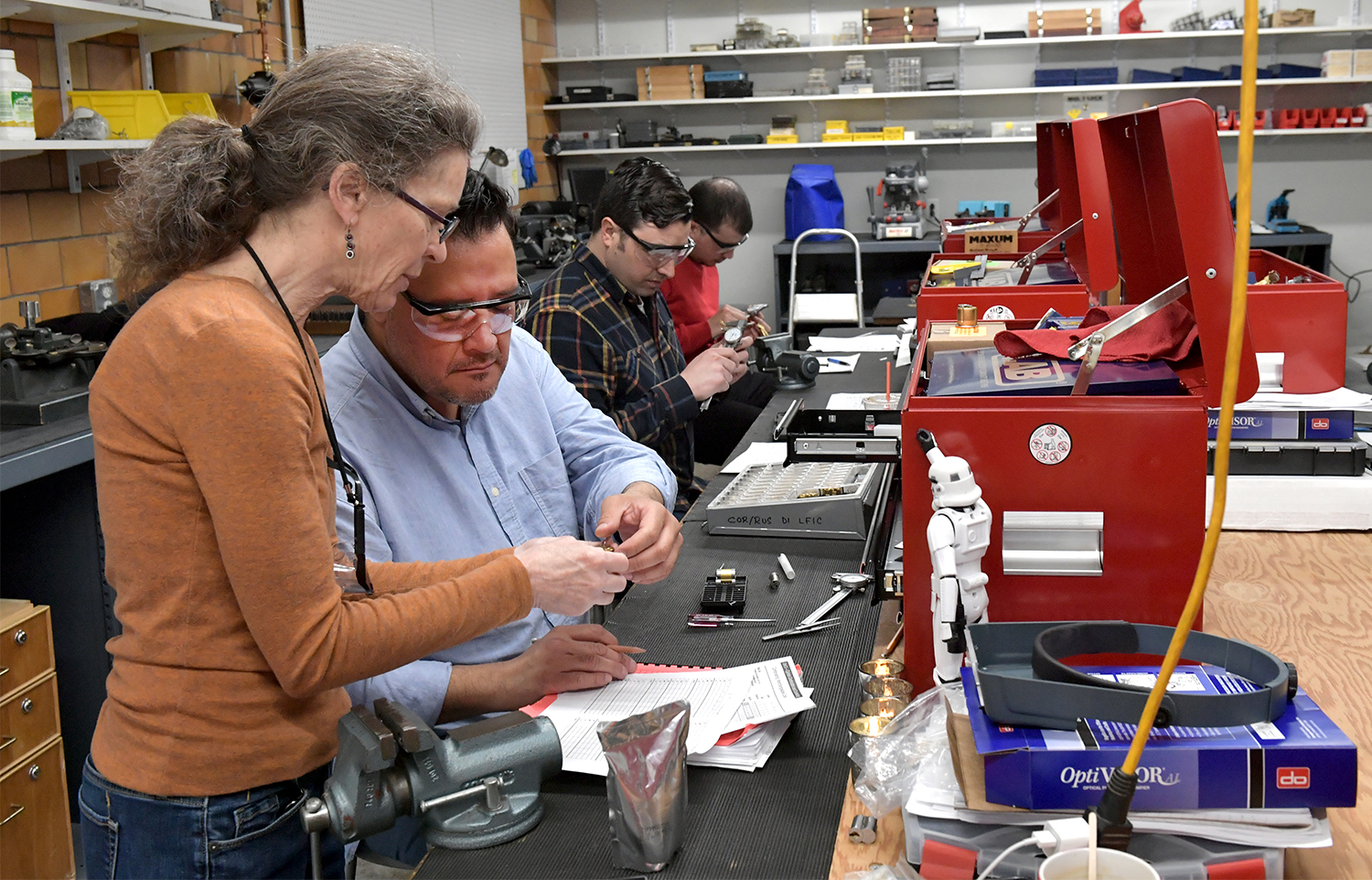 Locksmithing students with an instructor