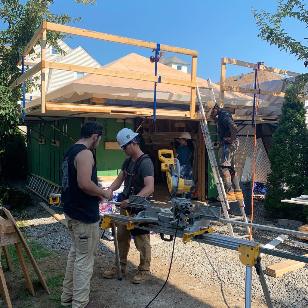 Students working on a garage in Quincy