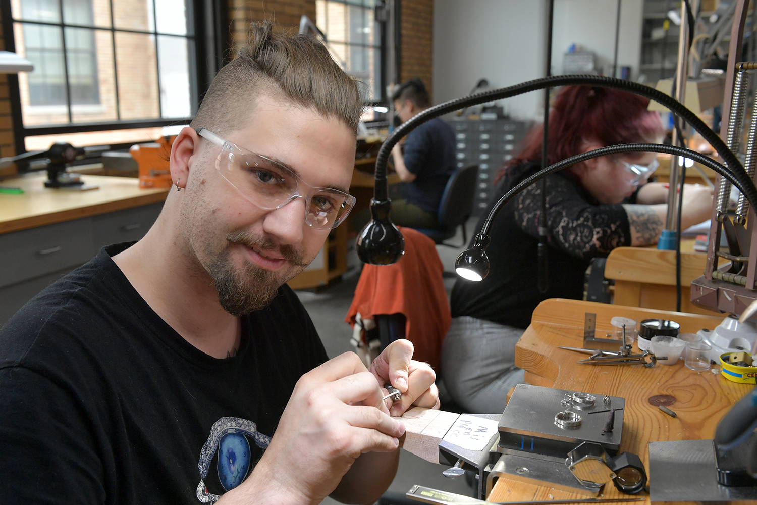 Jewelry maker at their bench