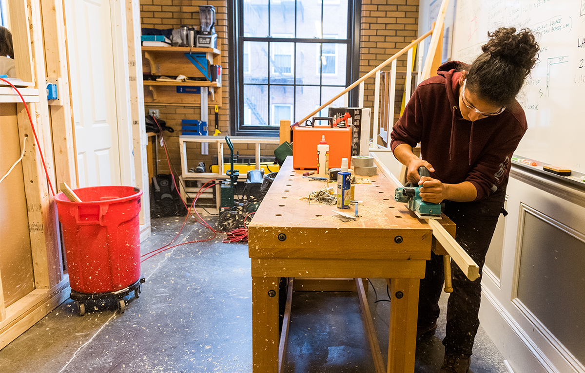 Student inspecting tools