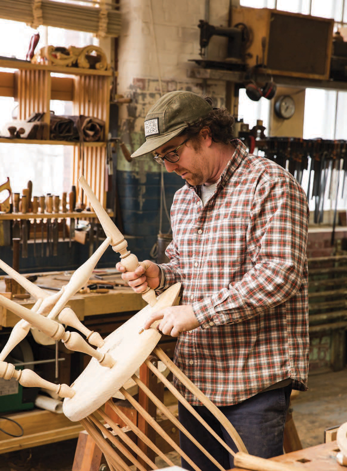 Kinnane holds a nearly finished Windsor chair.