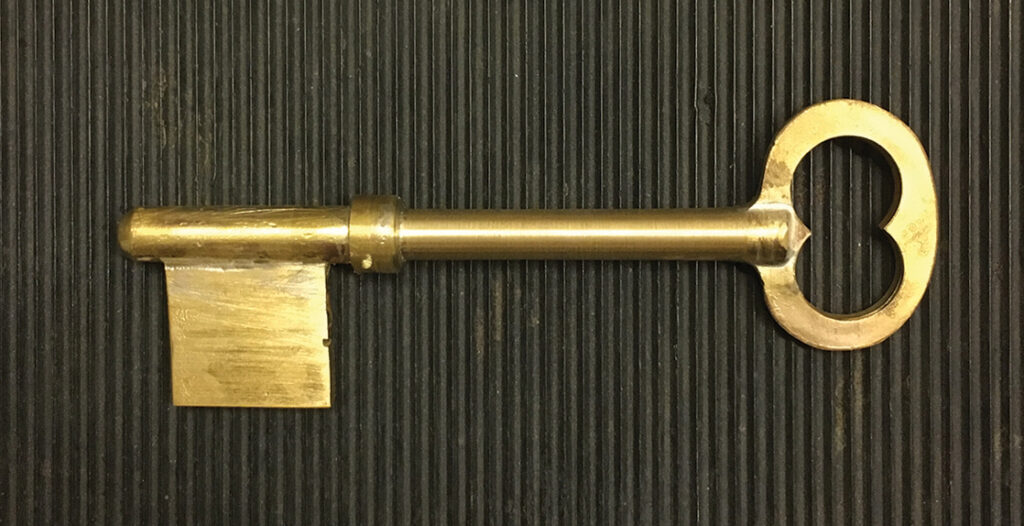 The key blank used by Barb Baker LK `04, Department Head of Locksmithing & Security Technology, and her team to craft the replica key.