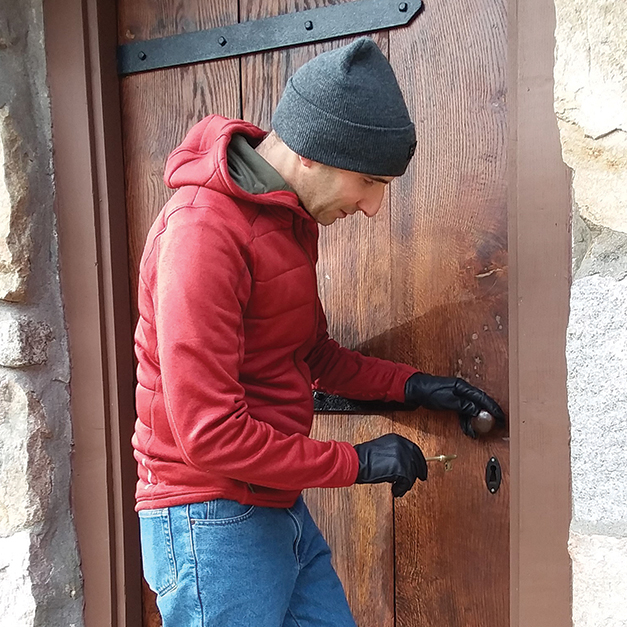 Yanni Tsipis trying his new custom key into the restored cottage door