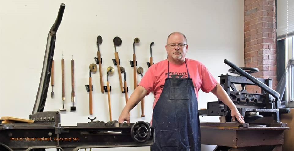 Todd in his bindery space