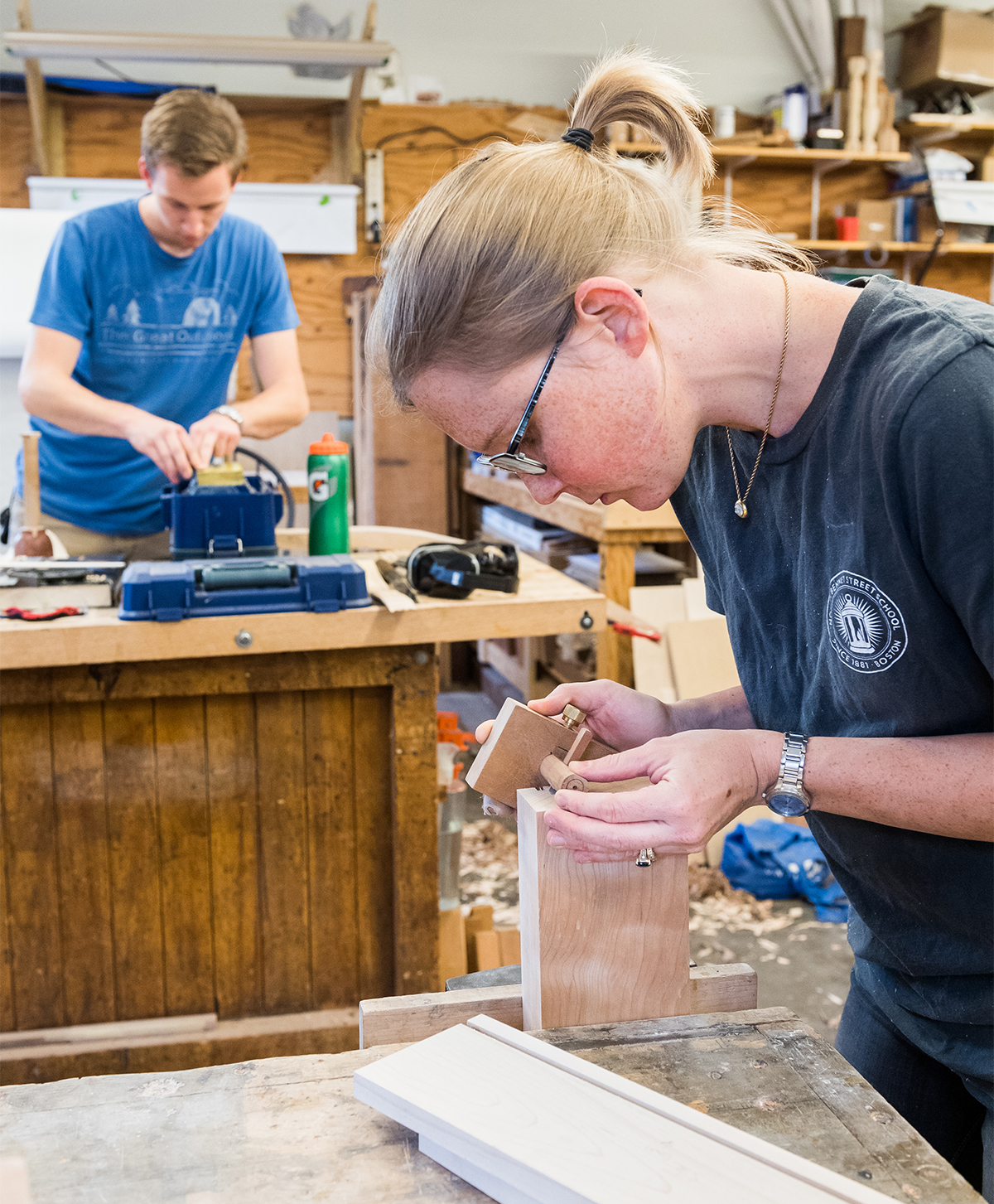 Veteran woodworkers at their benches