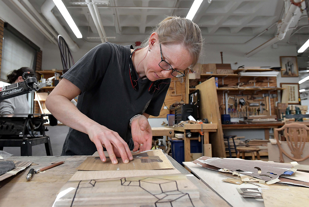 Abbie Smith at work creating marquetry