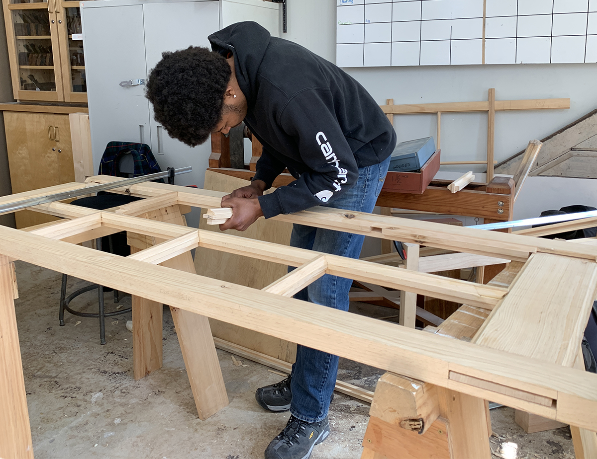 Diego working on a set of french doors.