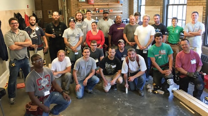 Carpentry class of 2016 flanked by their instructors