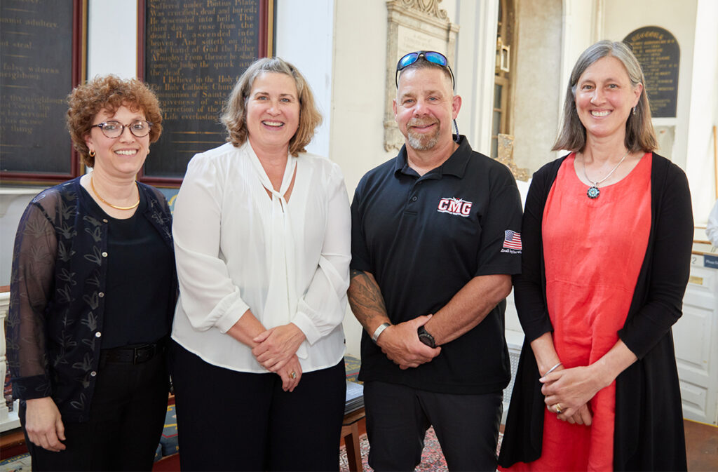 Kurt Fieldhouse at the 2022 Graduation ceremony with Provost Claire Fruitman, President Sarah Turner, and Board Chair Genie Thorndike