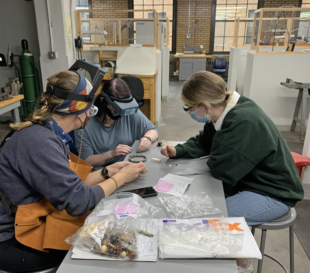 NBSS jewelry students identifying donations