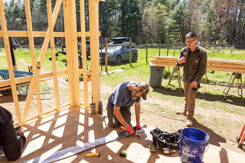 Plamen and Viet working on a Carpentry class project, building horse sheds.