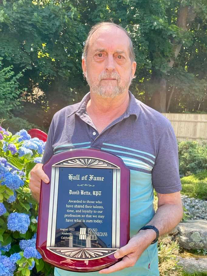 David Betts holding the Hall of Fame award