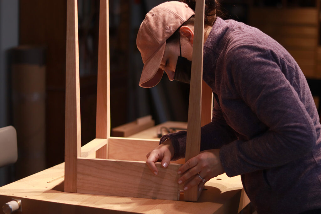 Student constructing a Shaker table