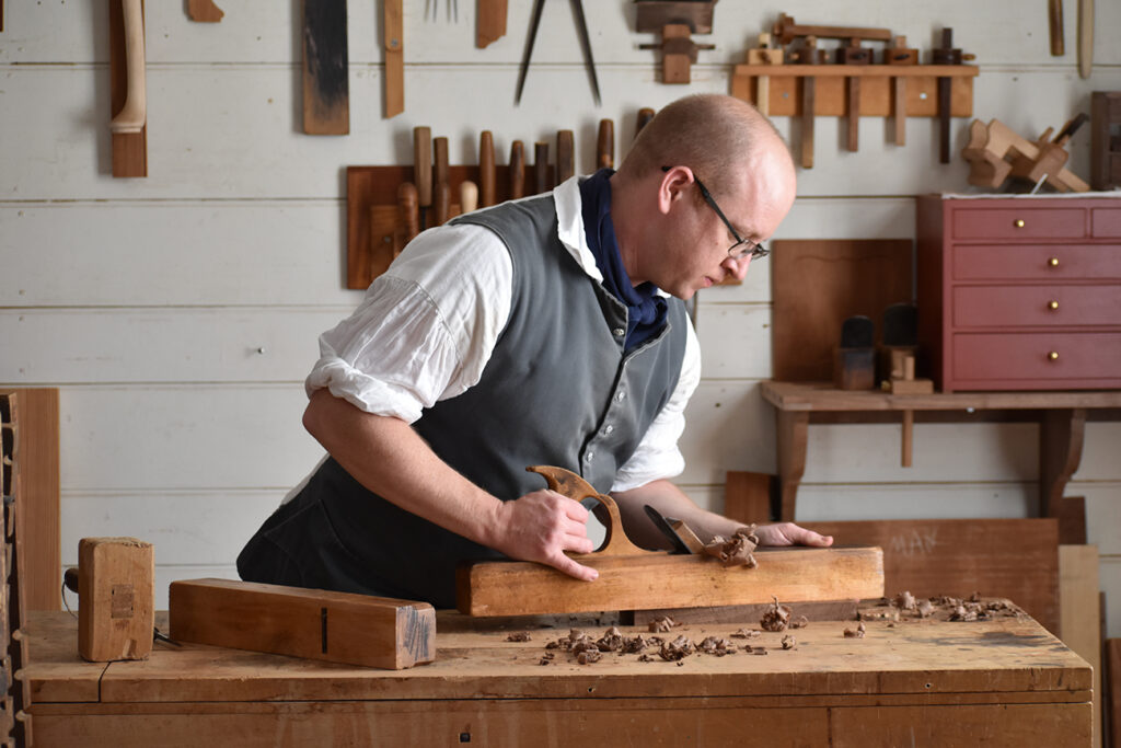 Jeremy Tritchler using a hand plane