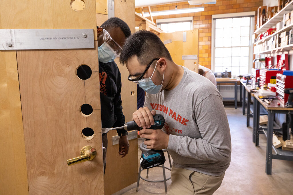 Sonny cutting a door blank with instructor Eddy