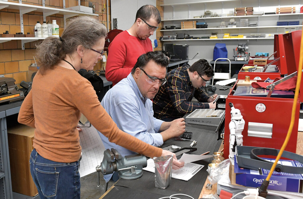 Barb teaching a locksmithing student