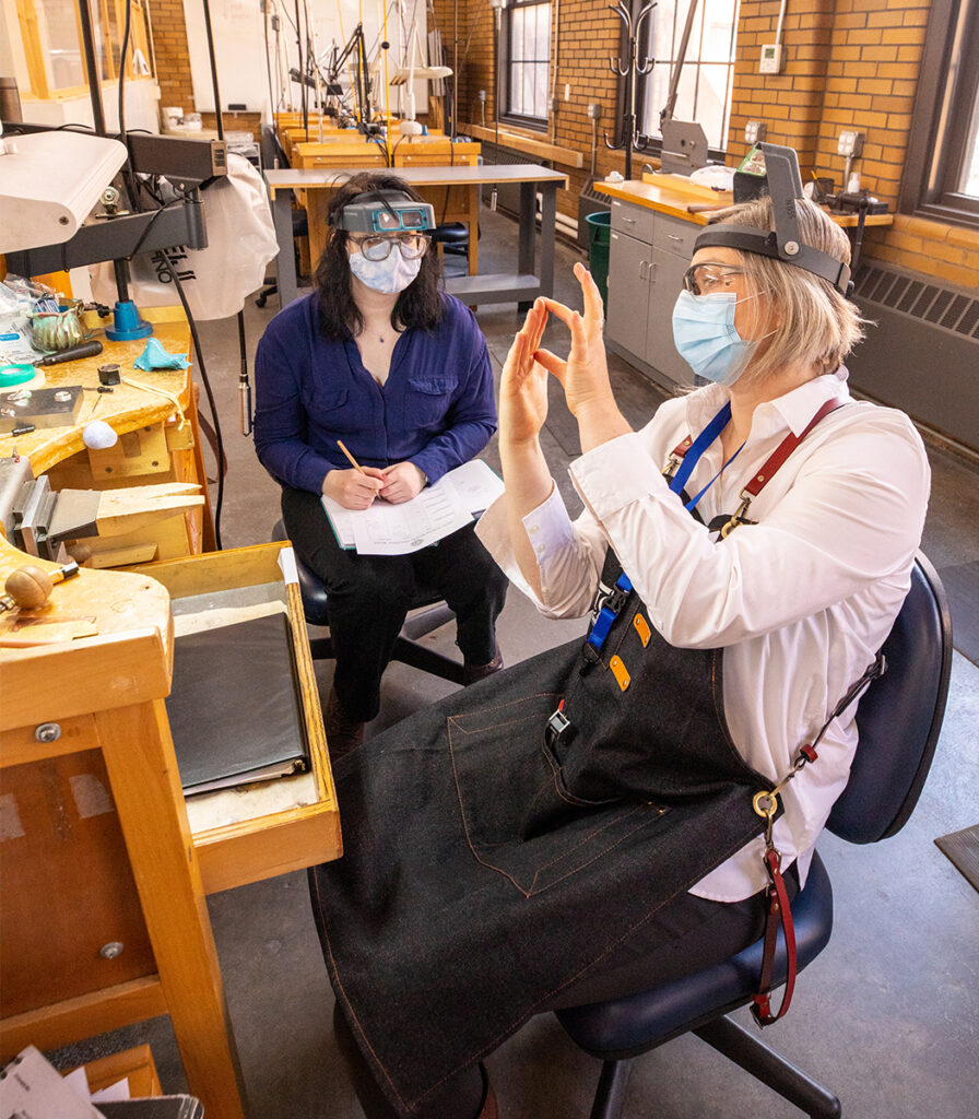 Teaching Assistant Marei Dose with a Jewelry Making student