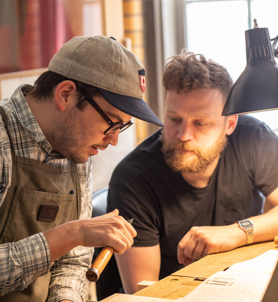 Teaching Assistant Nathan Abbe with a Violin Making & Repair student