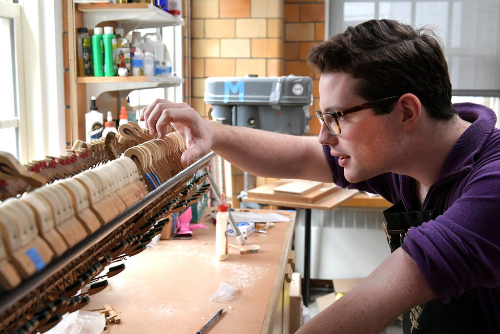 Will Roper inspecting hammers, as a student
