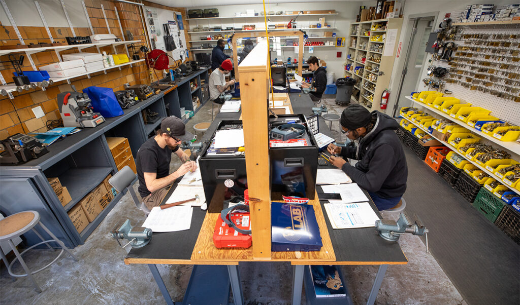 Students in locksmithing bench room