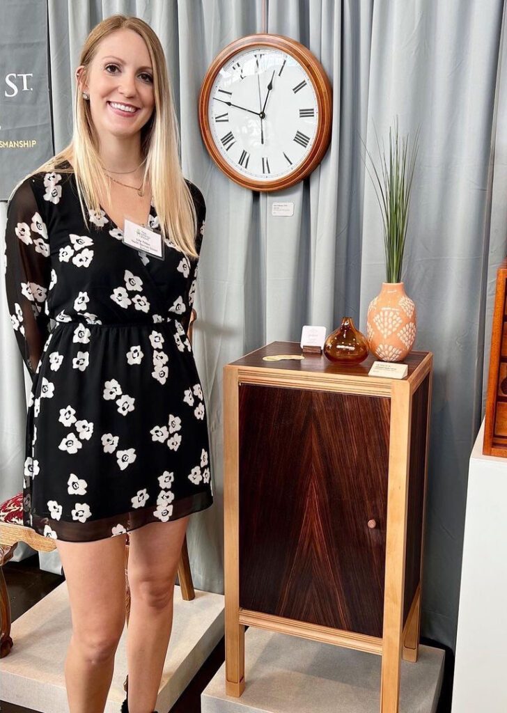 Lily Tilton with a cabinet she made