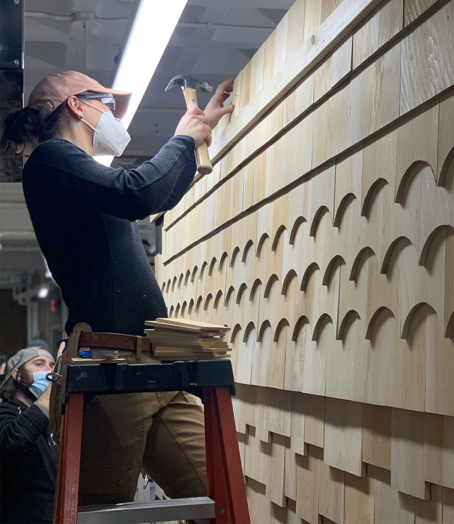 Svetlana installing trim as a Carpentry student