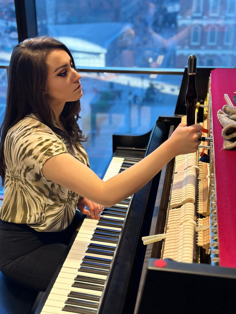 Brittany tuning Boston Mayor Wu's piano in City Hall