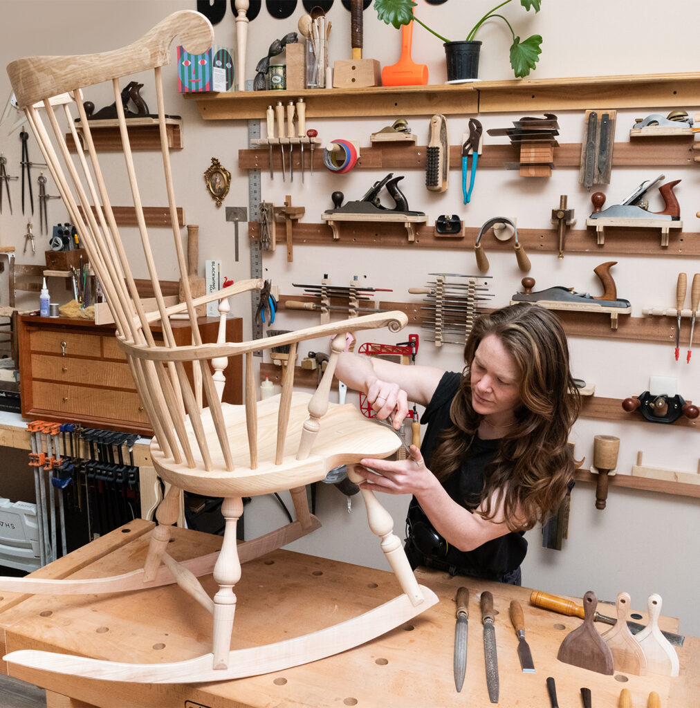Aspen in her workshop, crafting a windsor rocking chair of her own design. Photo: Loam Marketing.