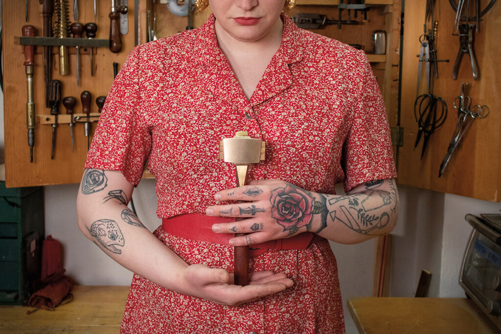 Eleanor Ingrid Rose holding her brass and rosewood infill mallet, available at thechairmakerstoolbox.com. Photo: Stacey Motte.
