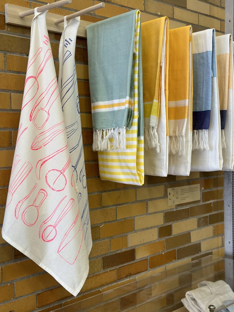 Printed towels of Emmet Van Drische's spoon patterns made by Shepherd & Maudsleigh Studios and textiles by Kara Weaves