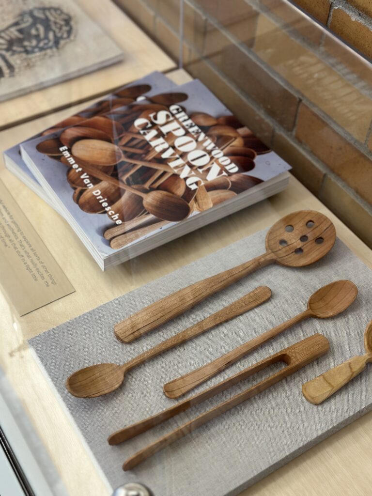 Hand-carved spoons and book by Emmet Van Driesche