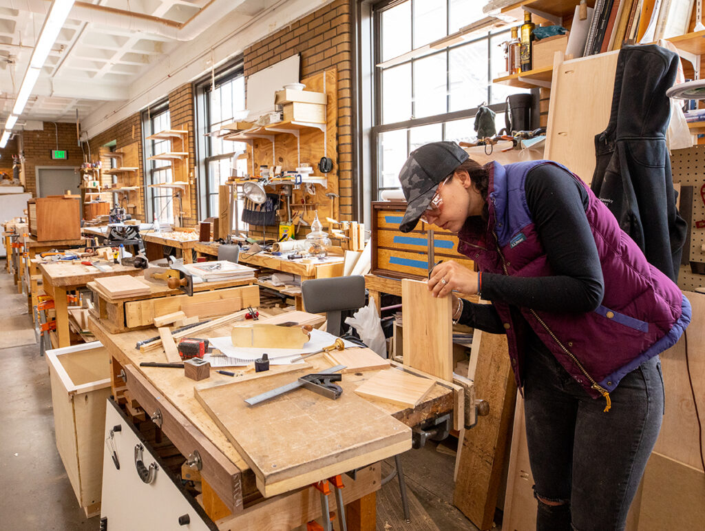 Svetlana at her bench as a Cabinet & Furniture Making student