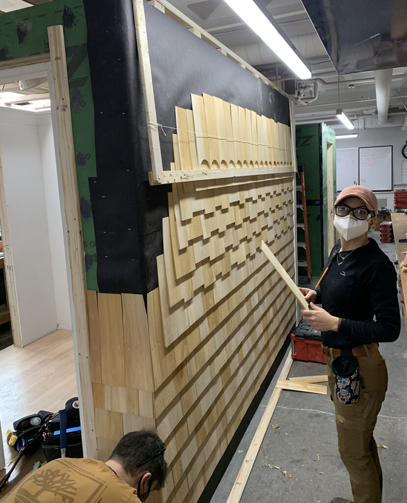 Svetlana working on Bennet Town while a Carpentry student