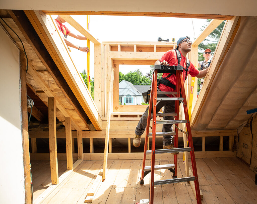 Wali working on a home renovation during the Carpentry program